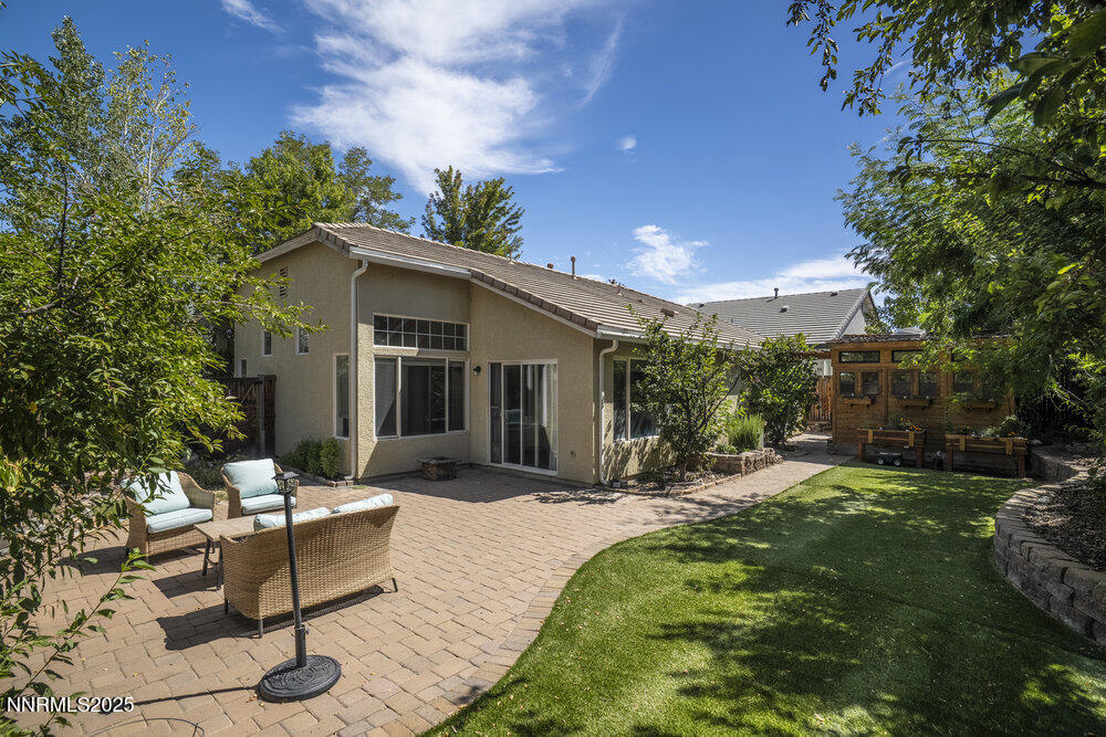 1706 River Gorge Court Reno, NV 89521 - Photo 35 of 40 a view of a house with backyard and sitting area