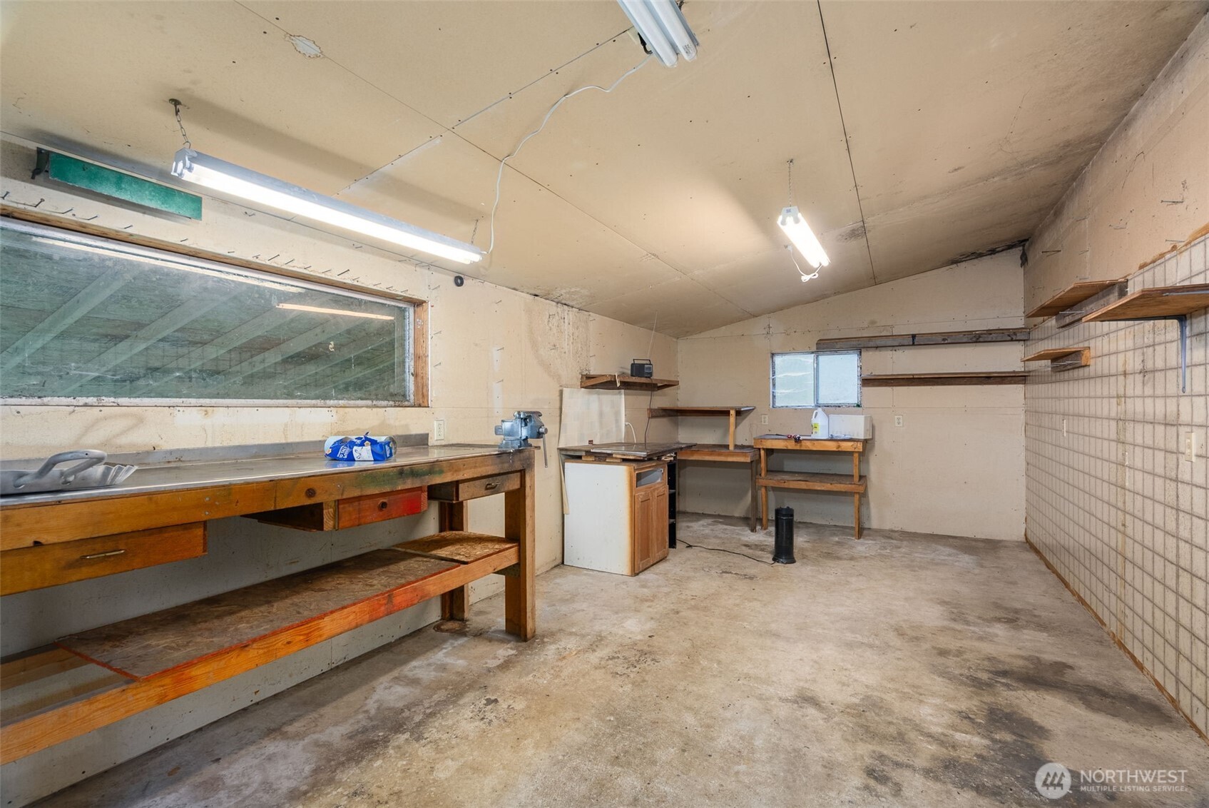 6091 Northeast Twin Spits Road Hansville, WA 98340 - Photo 25 of 34 a storage room with racks