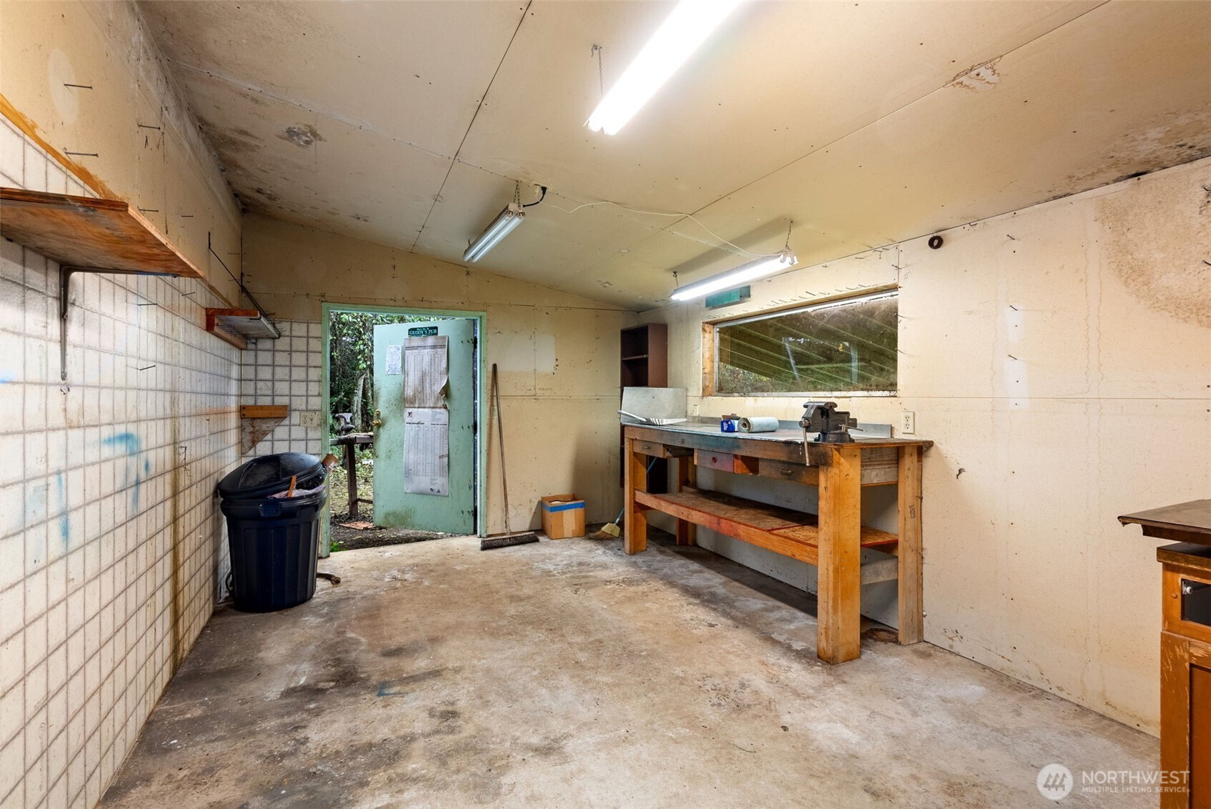 6091 Northeast Twin Spits Road Hansville, WA 98340 - Photo 26 of 34 a view of a livingroom with furniture and a window