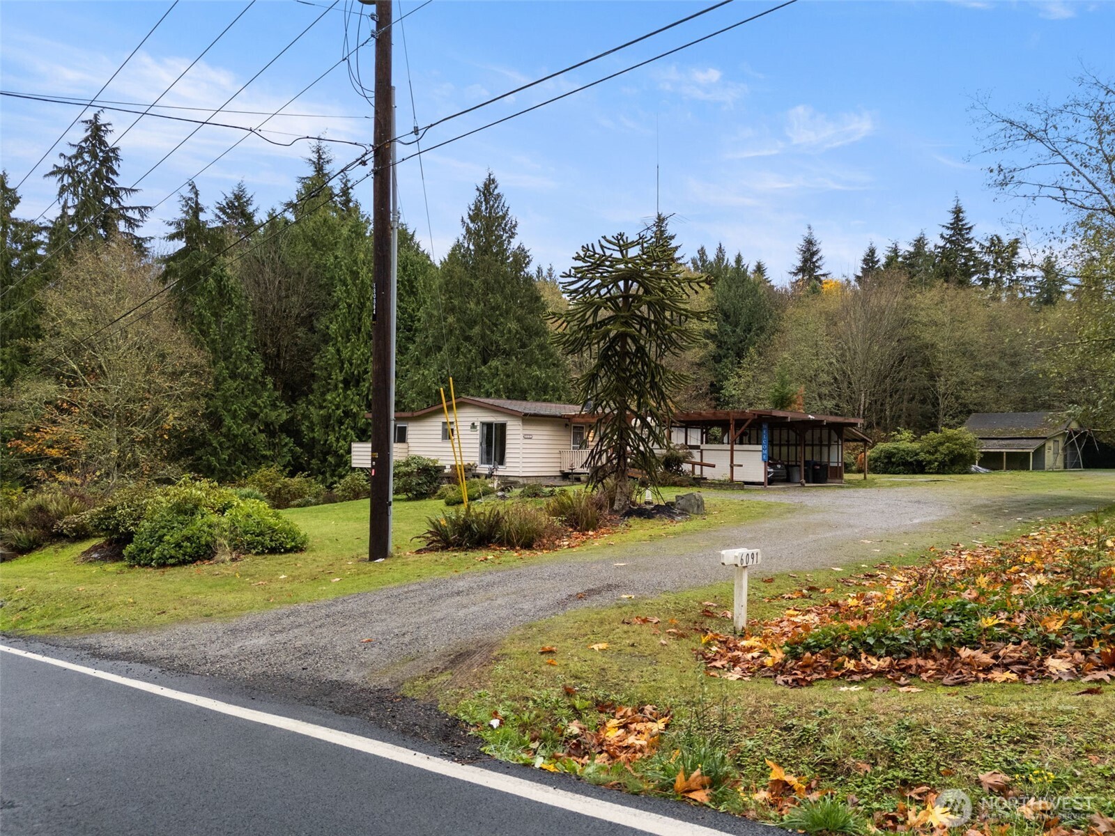 6091 Northeast Twin Spits Road Hansville, WA 98340 - Photo 30 of 34 a view of a yard with potted plants