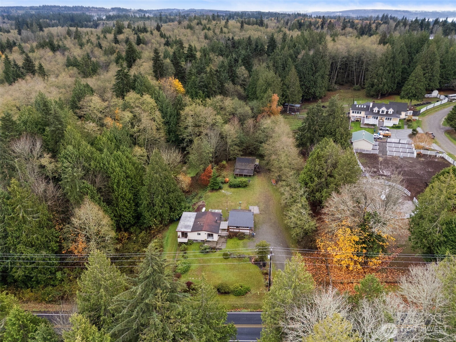 6091 Northeast Twin Spits Road Hansville, WA 98340 - Photo 33 of 34 an aerial view of a house with a yard