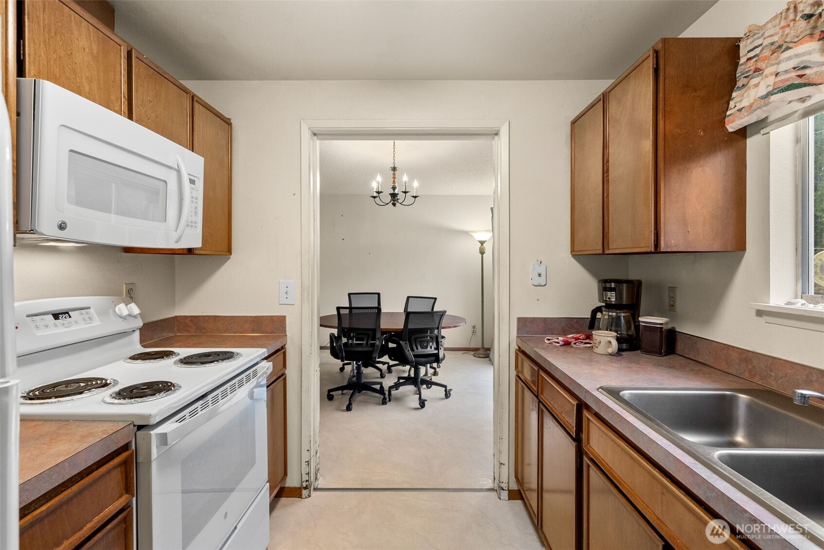 6091 Northeast Twin Spits Road Hansville, WA 98340 - Photo 4 of 34 a kitchen that has a sink and a stove