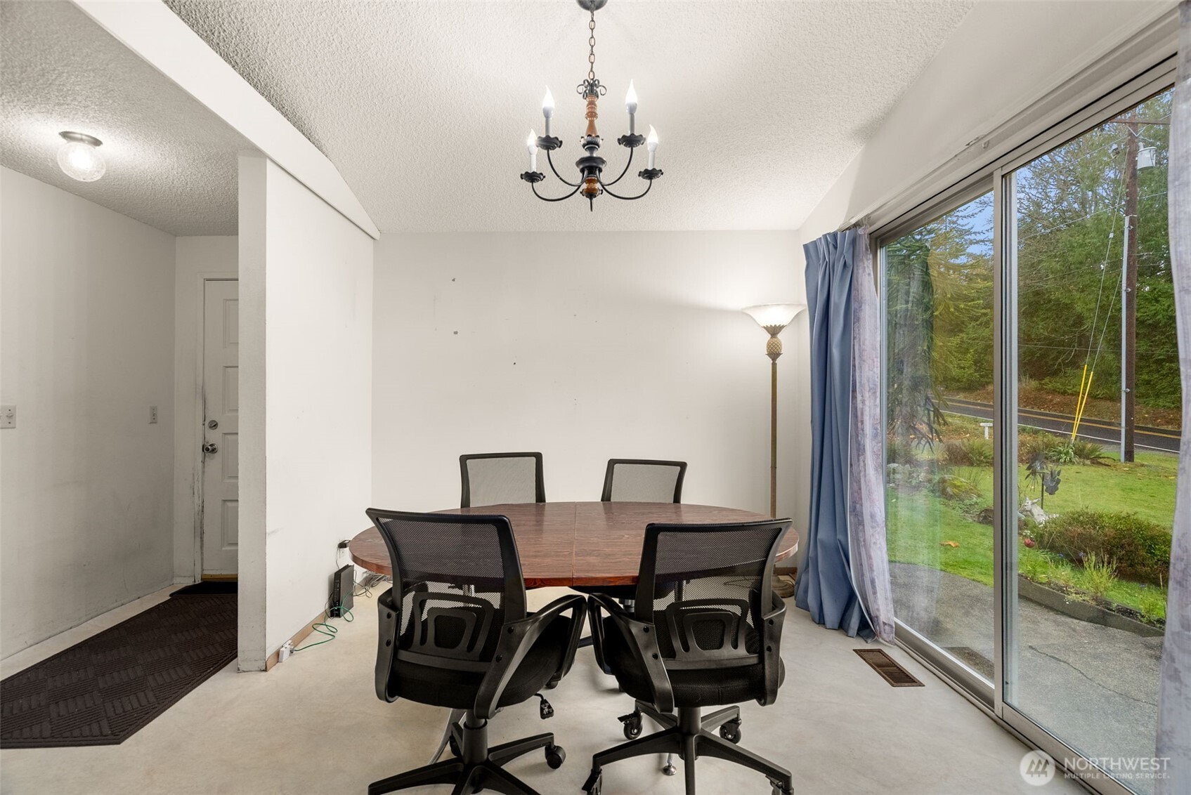 6091 Northeast Twin Spits Road Hansville, WA 98340 - Photo 6 of 34 a view of a dining room with furniture window and outside view