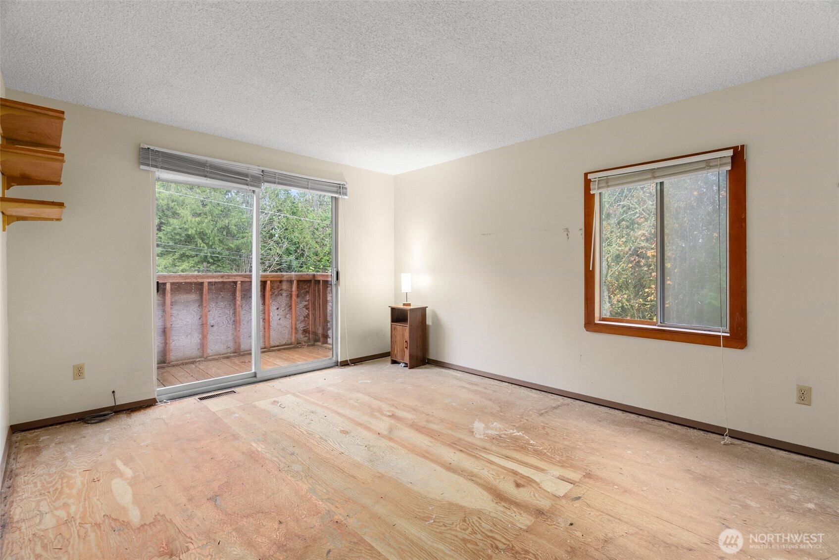 6091 Northeast Twin Spits Road Hansville, WA 98340 - Photo 10 of 34 a view of an empty room with a window