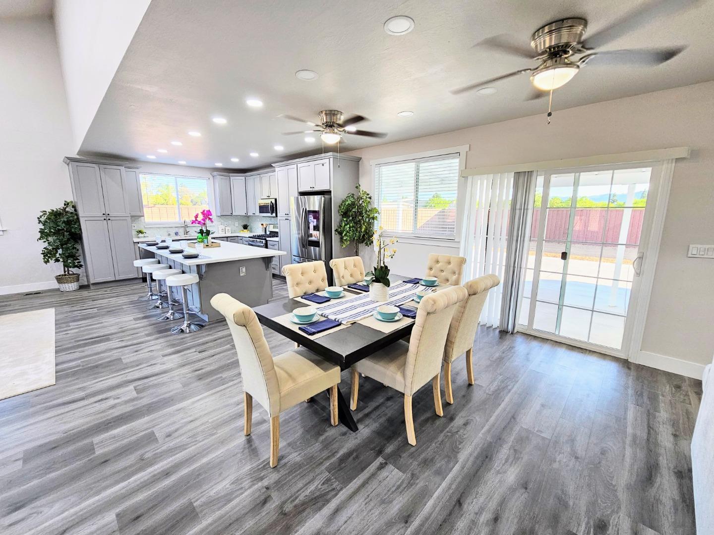17675 Laurel Road Morgan Hill, CA 95037 - Photo 11 of 49 a view of a dining room with furniture window and wooden floor