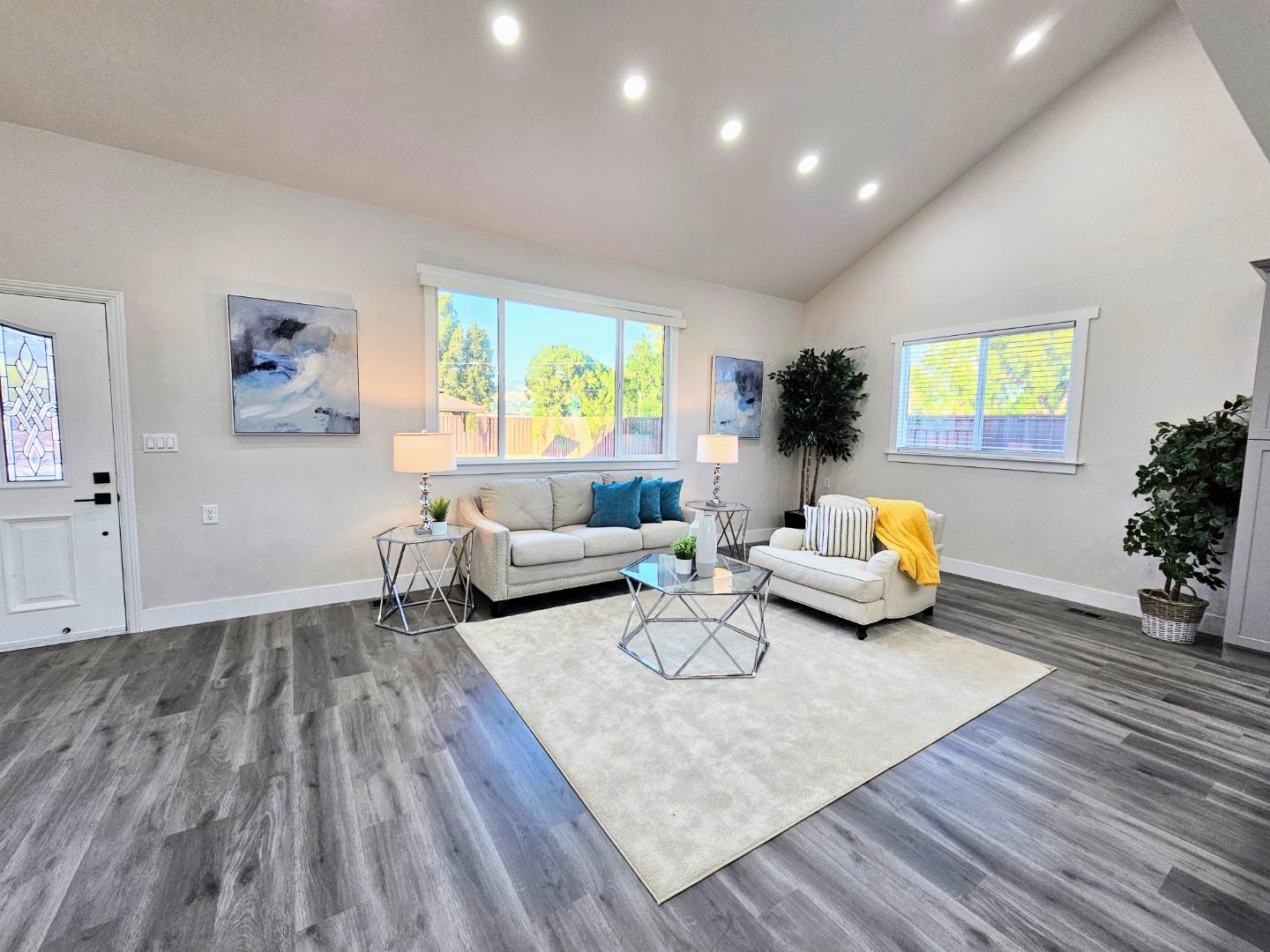 17675 Laurel Road Morgan Hill, CA 95037 - Photo 13 of 49 a living room with furniture and a potted plant