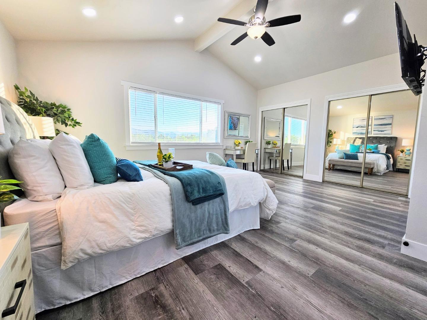 17675 Laurel Road Morgan Hill, CA 95037 - Photo 22 of 49 a bedroom with a large bed and windows