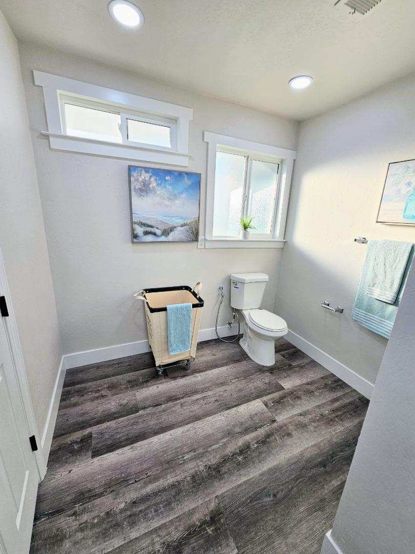 17675 Laurel Road Morgan Hill, CA 95037 - Photo 25 of 49 a spacious bathroom with a toilet a sink and a window