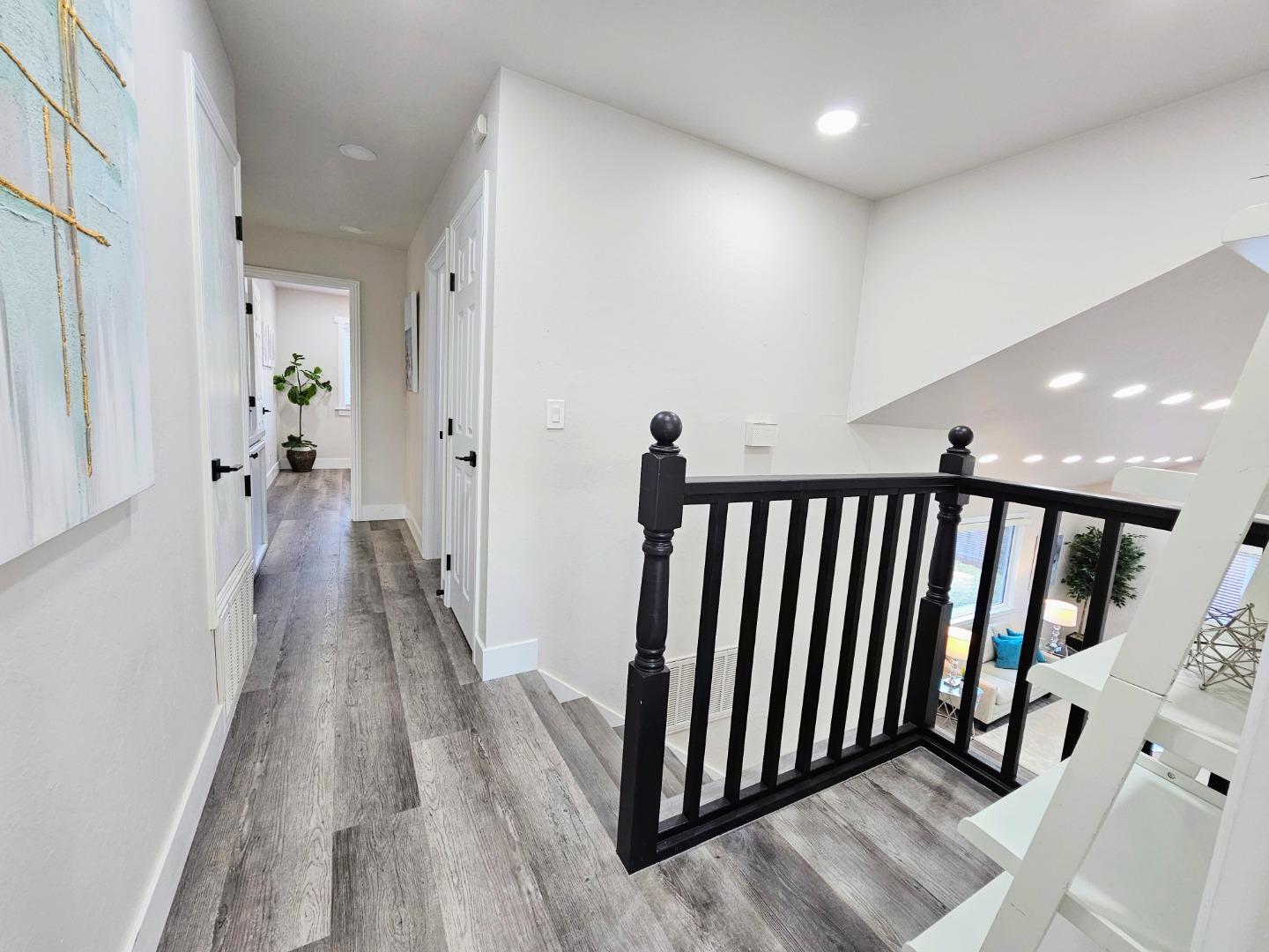 17675 Laurel Road Morgan Hill, CA 95037 - Photo 26 of 49 a view of a hallway with wooden floor and staircase