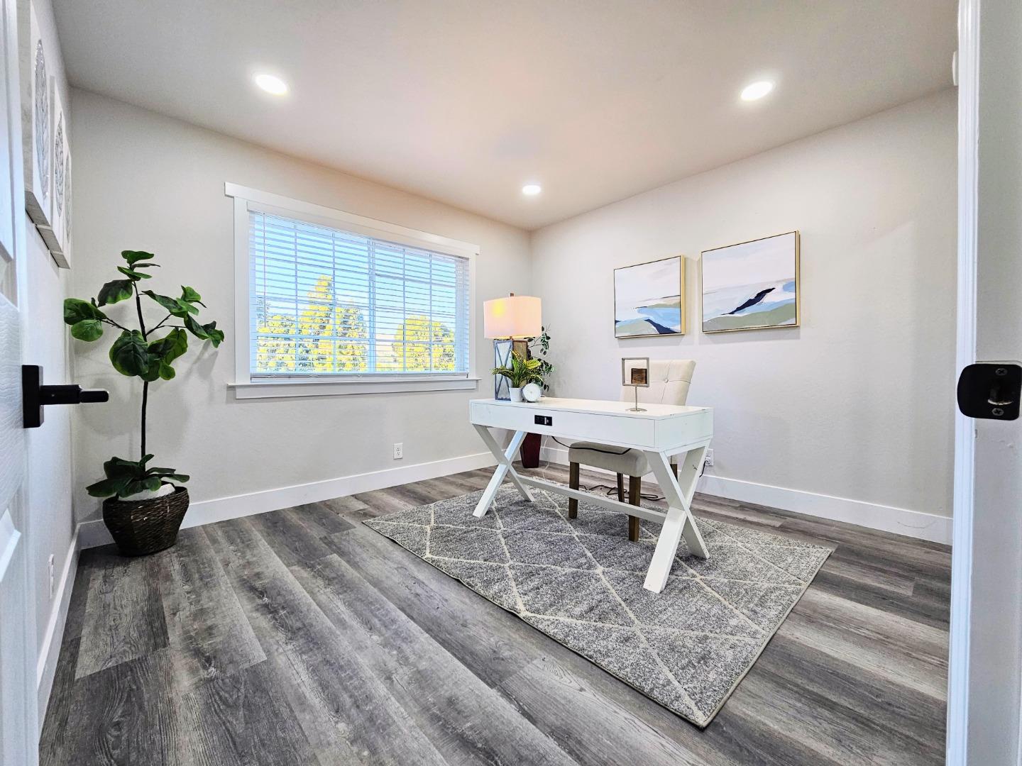 17675 Laurel Road Morgan Hill, CA 95037 - Photo 27 of 49 a living room with furniture and a potted plant