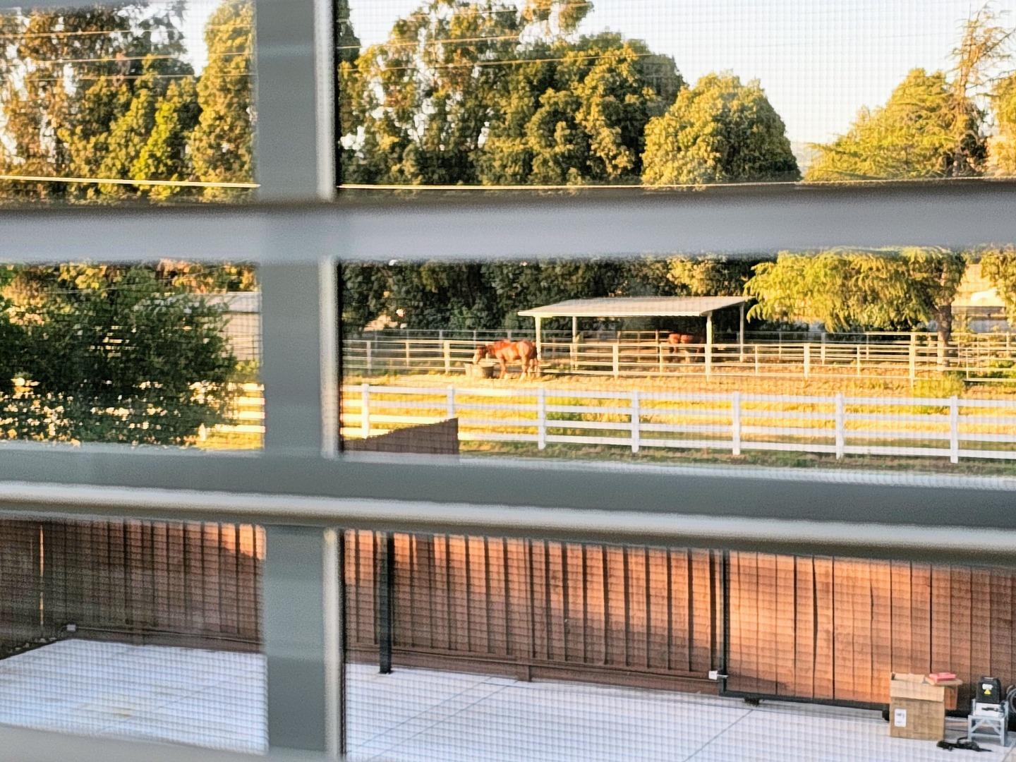 17675 Laurel Road Morgan Hill, CA 95037 - Photo 28 of 49 a view of a balcony with dining table and wooden floor