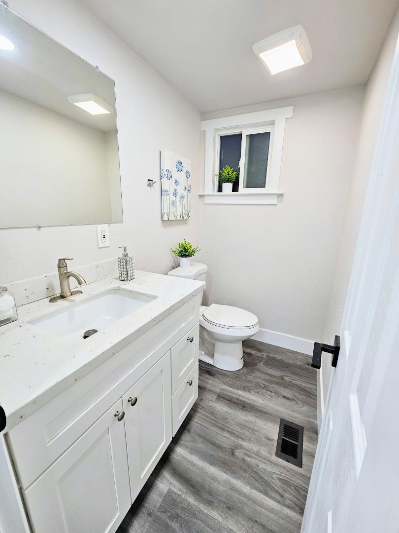 17675 Laurel Road Morgan Hill, CA 95037 - Photo 33 of 49 a spacious bathroom with a toilet sink and mirror