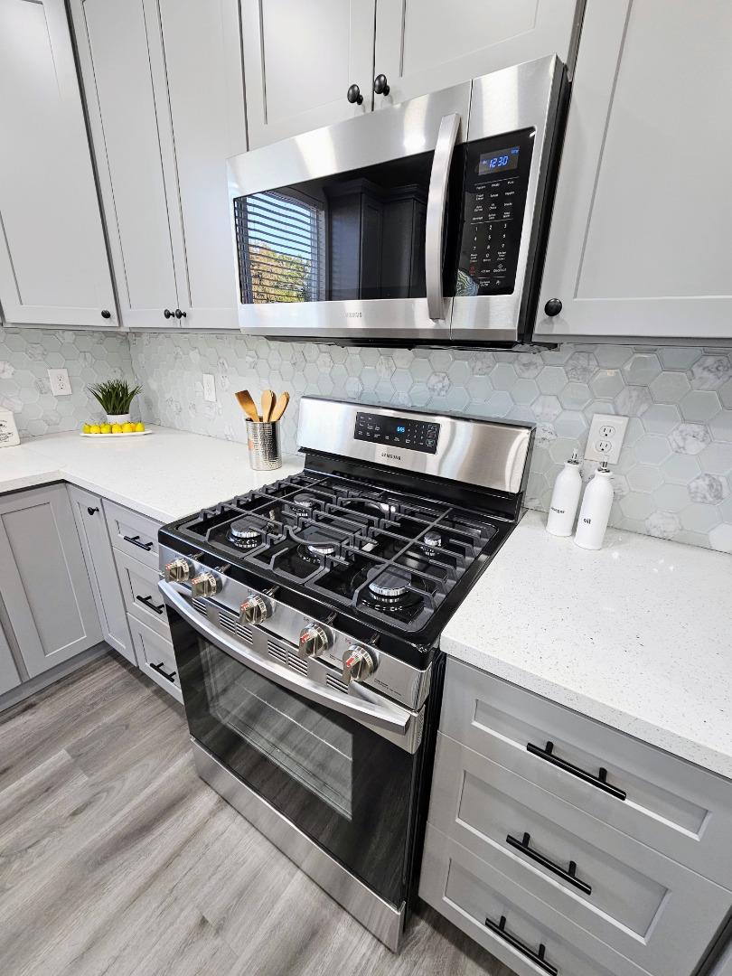 17675 Laurel Road Morgan Hill, CA 95037 - Photo 9 of 49 a stove top oven sitting inside of a kitchen