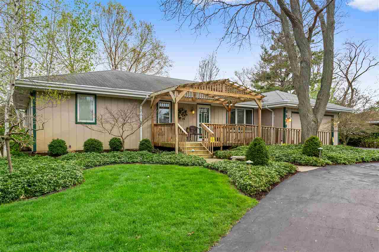 6871 Spring Brook Road Rockford, IL 61114 - Photo 1 of 24 a front view of a house with a garden