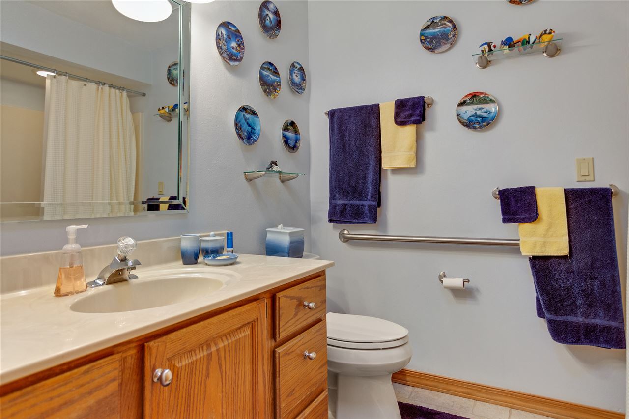 6871 Spring Brook Road Rockford, IL 61114 - Photo 13 of 24 a bathroom with a sink and a mirror