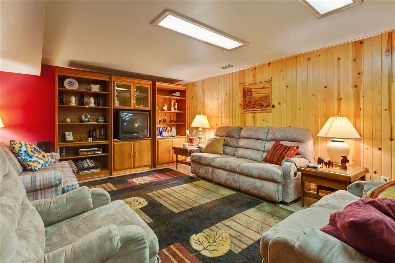 6871 Spring Brook Road Rockford, IL 61114 - Photo 15 of 24 a living room with furniture and a large window