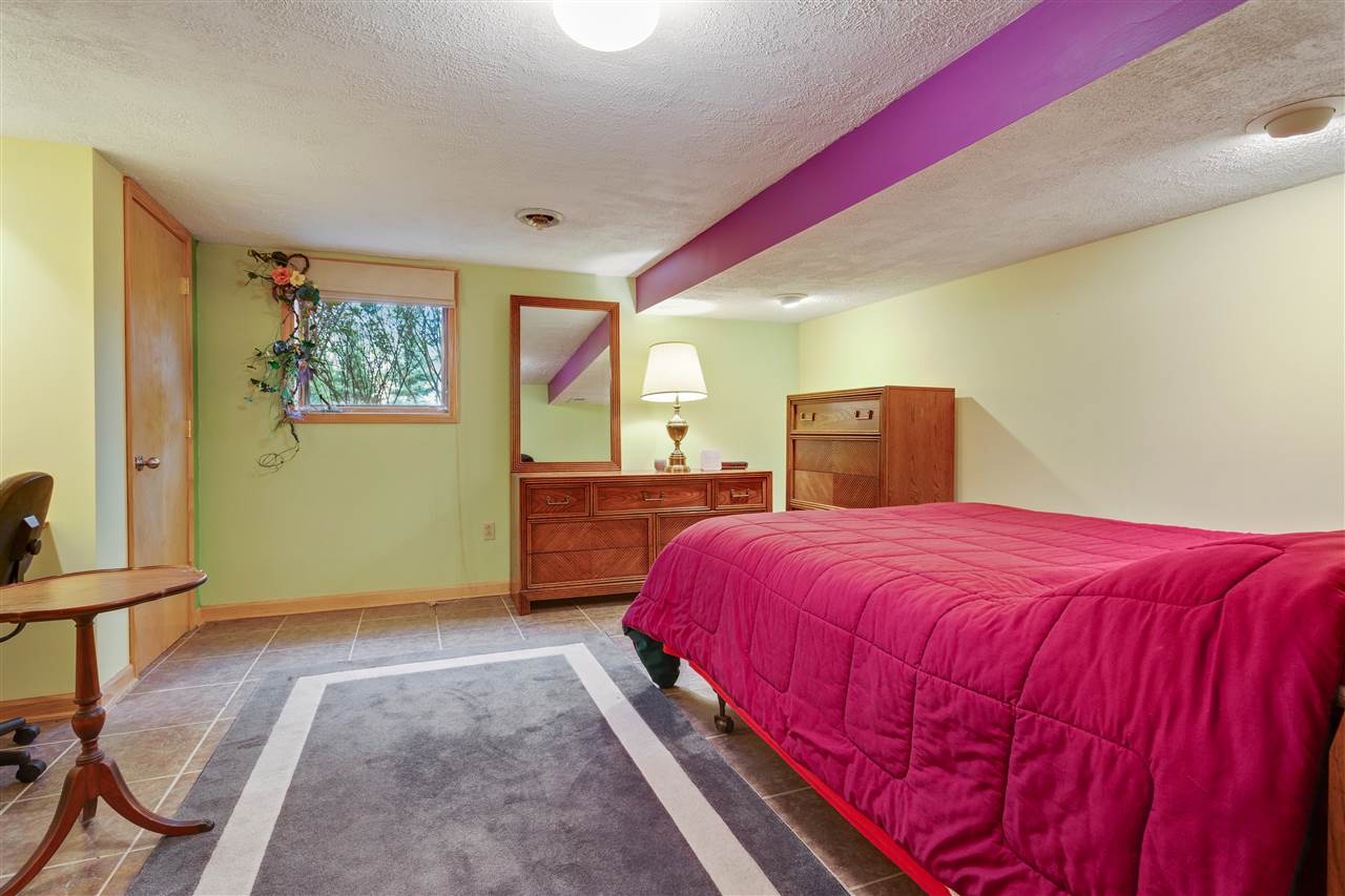 6871 Spring Brook Road Rockford, IL 61114 - Photo 17 of 24 a bedroom with a bed and a window