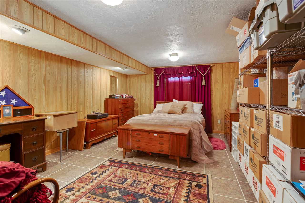 6871 Spring Brook Road Rockford, IL 61114 - Photo 19 of 24 a room with furniture a rug and a window