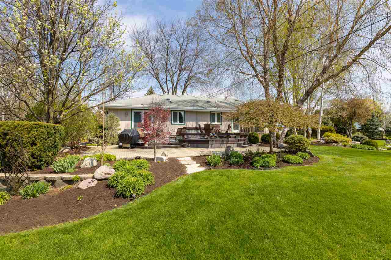6871 Spring Brook Road Rockford, IL 61114 - Photo 22 of 24 a view of a house with swimming pool and sitting area