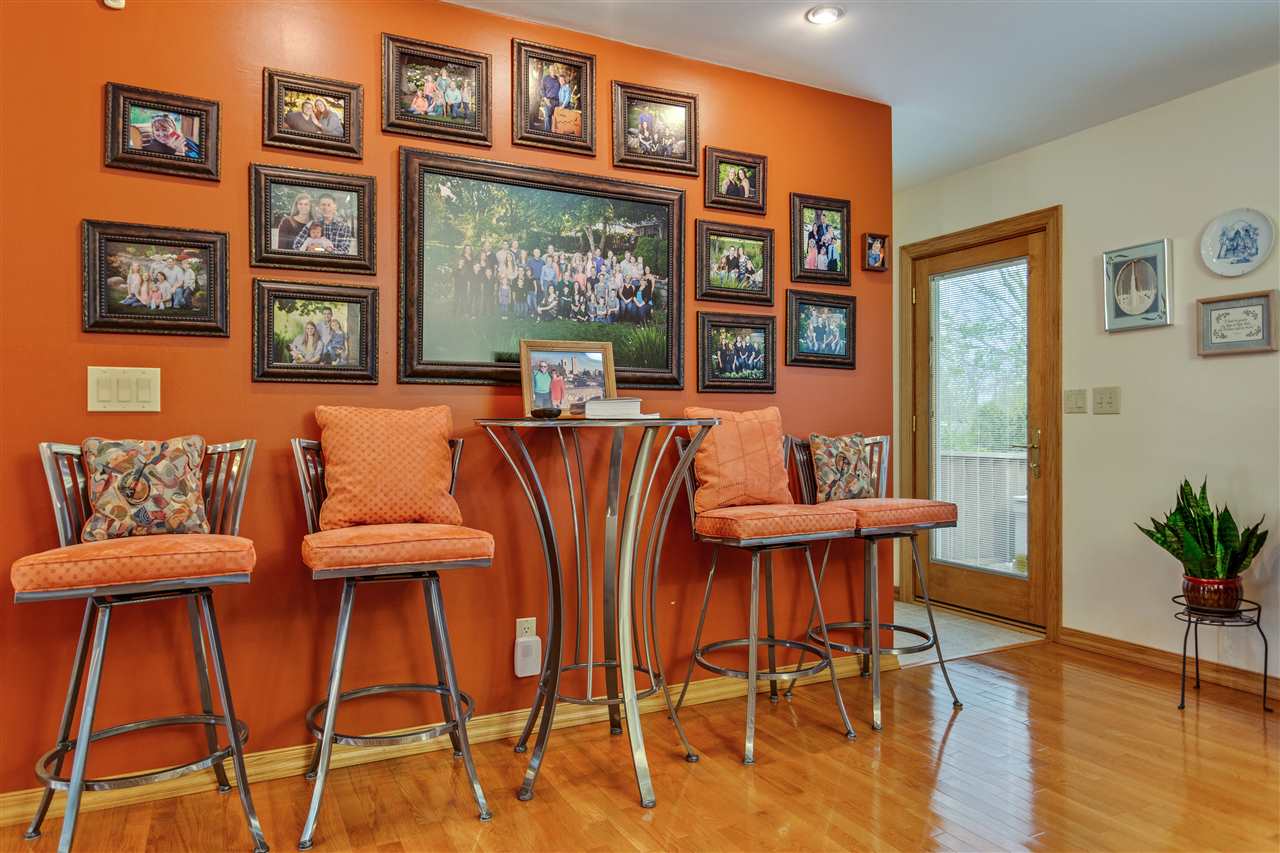6871 Spring Brook Road Rockford, IL 61114 - Photo 8 of 24 a dining room with furniture and wooden floor