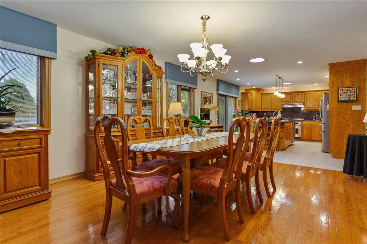 6871 Spring Brook Road Rockford, IL 61114 - Photo 9 of 24 a view of a dining room with furniture and wooden floor