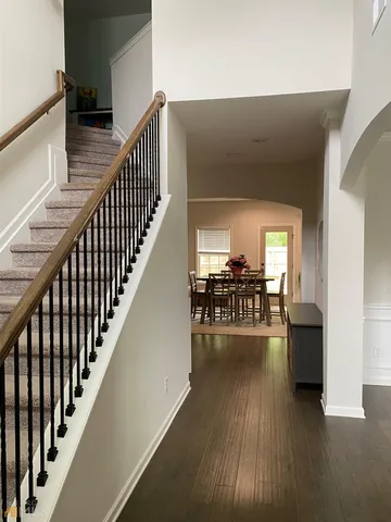 a view of entryway and livingroom with wooden floor