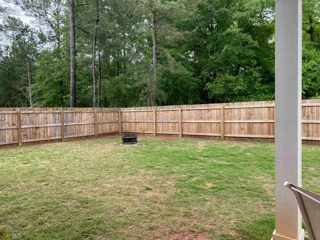 a view of backyard with green space