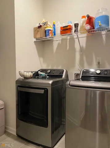 a close view of a stove top oven and sitting space