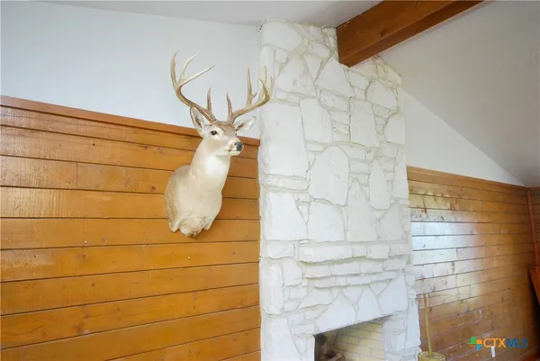 a kitchen with stainless steel appliances granite countertop a refrigerator a stove and a sink