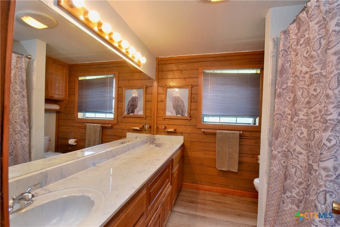 2725 Old Lehmann Road Seguin, TX 78155 - Photo 15 of 47 a bathroom with a sink and a mirror