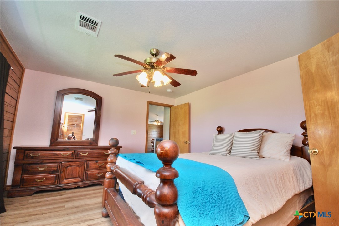 2725 Old Lehmann Road Seguin, TX 78155 - Photo 17 of 47 a bedroom with a bed and wooden floor