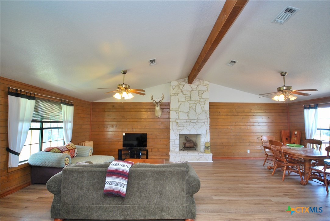 2725 Old Lehmann Road Seguin, TX 78155 - Photo 19 of 47 a living room with furniture dining table and a fireplace