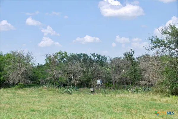 a view of lake with green space