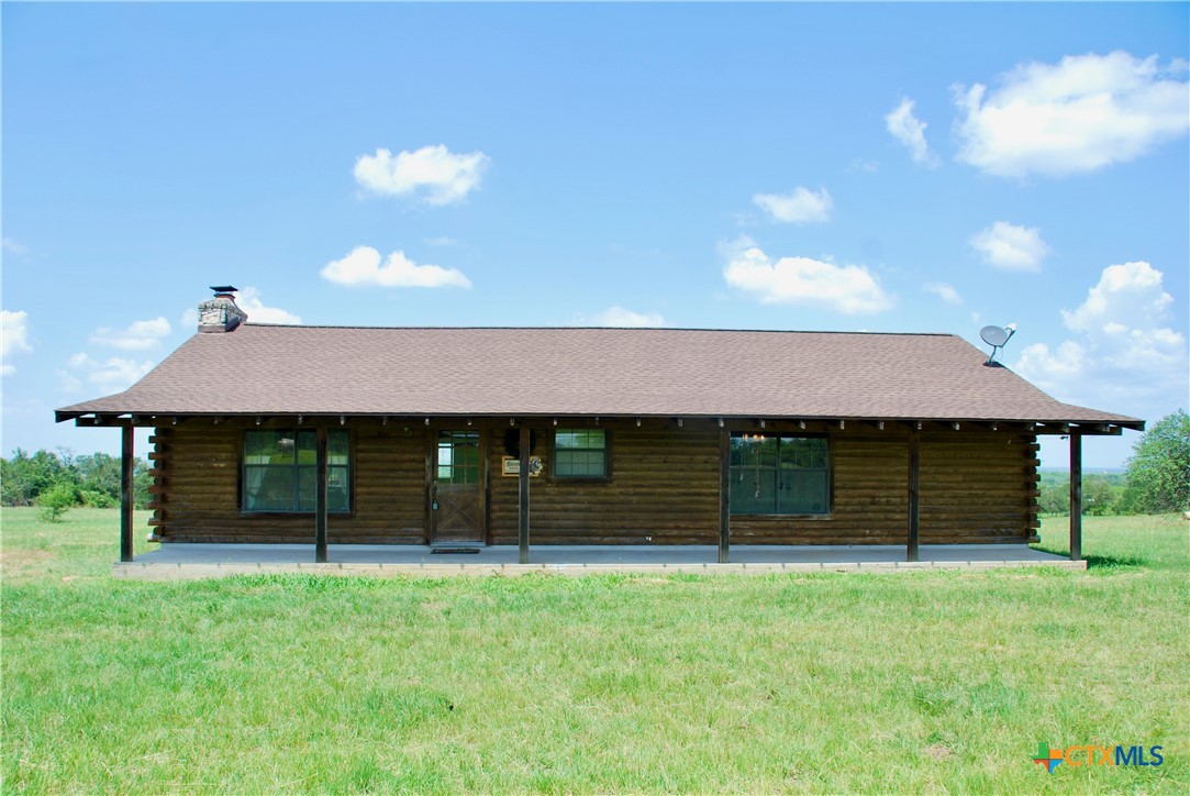 2725 Old Lehmann Road Seguin, TX 78155 - Photo 6 of 47 a front view of a house with a garden