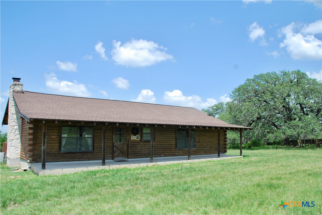 2725 Old Lehmann Road Seguin, TX 78155 - Photo 7 of 47 a front view of a house with a yard and garage