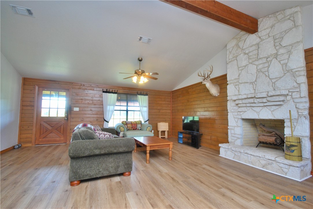 2725 Old Lehmann Road Seguin, TX 78155 - Photo 9 of 47 a living room with furniture and a fireplace