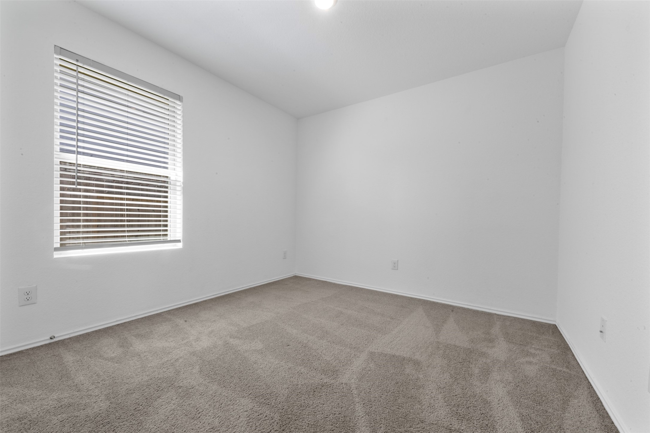 14506 Broadbury Pond Road Rosharon, TX 77583 - Photo 19 of 25 an empty room with a window