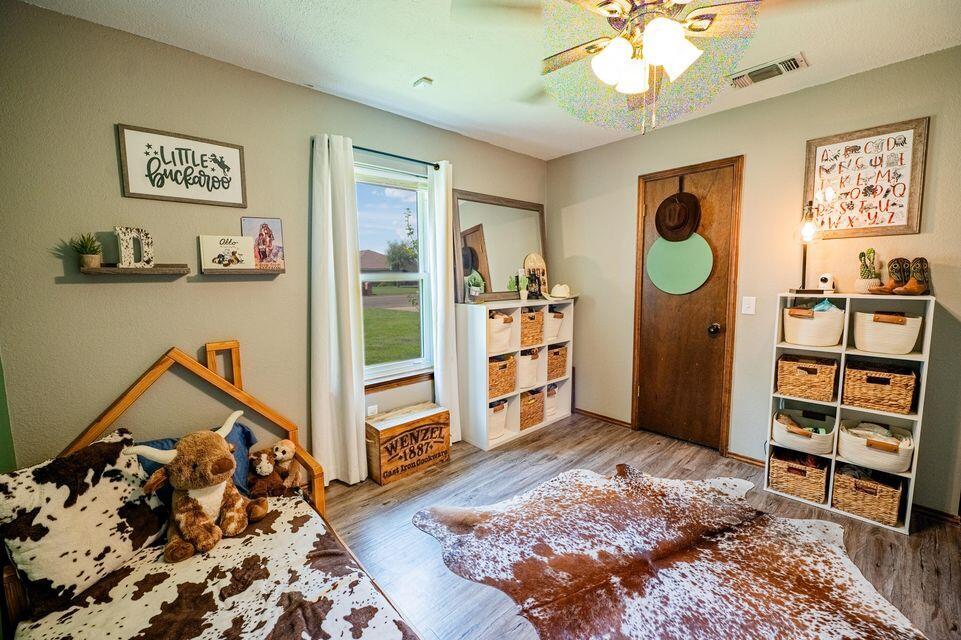 2914 Kermit Drive Plainview, TX 79072 - Photo 13 of 18 a bedroom with a bed and a closet