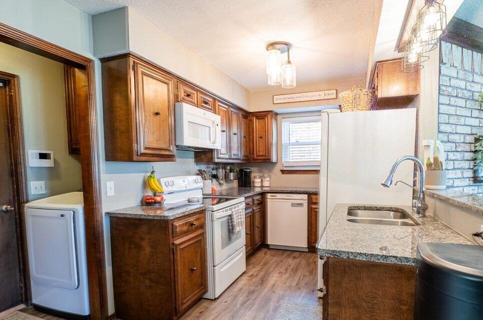 2914 Kermit Drive Plainview, TX 79072 - Photo 4 of 18 a kitchen with a sink cabinets and window