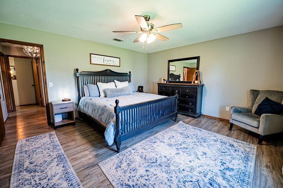 2914 Kermit Drive Plainview, TX 79072 - Photo 8 of 18 a bedroom with a bed and a couch