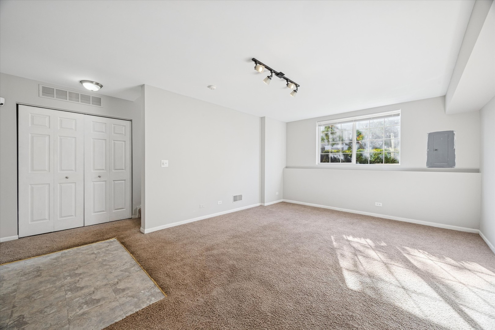 117 Enclave Circle, Unit C Bolingbrook, IL 60440 - Photo 13 of 19 a view of an empty room with a window