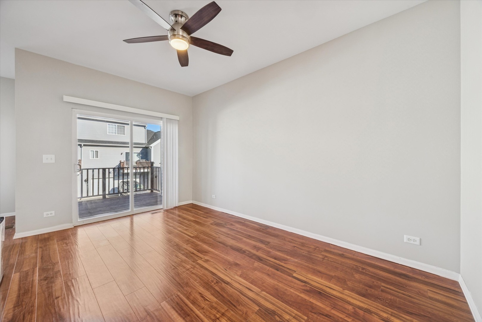 117 Enclave Circle, Unit C Bolingbrook, IL 60440 - Photo 3 of 19 a view of wooden floor and a chandelier fan in a room