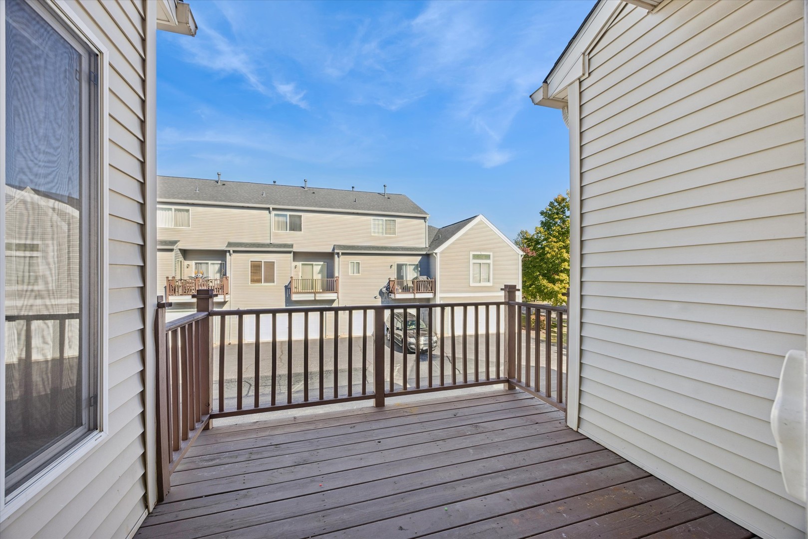 117 Enclave Circle, Unit C Bolingbrook, IL 60440 - Photo 7 of 19 a view of a balcony with wooden floor