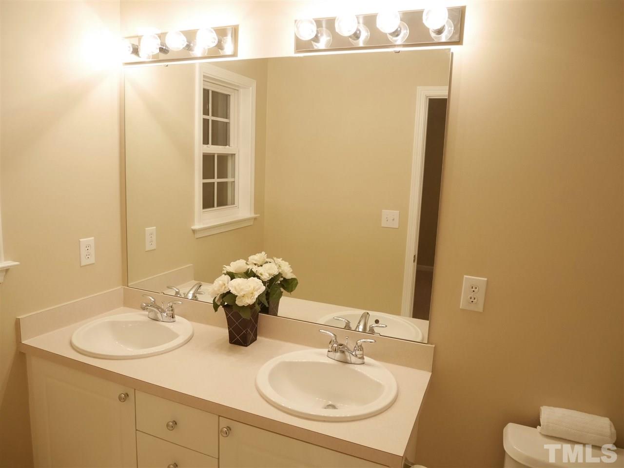 2300 Persimmon Ridge Drive Raleigh, NC 27604 - Photo 11 of 20 a bathroom with a sink and mirror