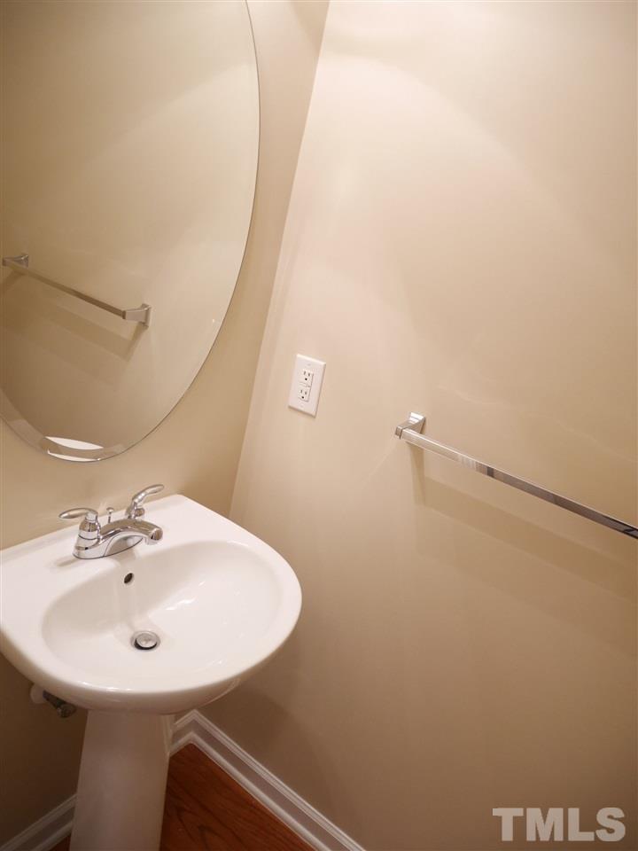 2300 Persimmon Ridge Drive Raleigh, NC 27604 - Photo 14 of 20 a bathroom with a sink a mirror and a shower