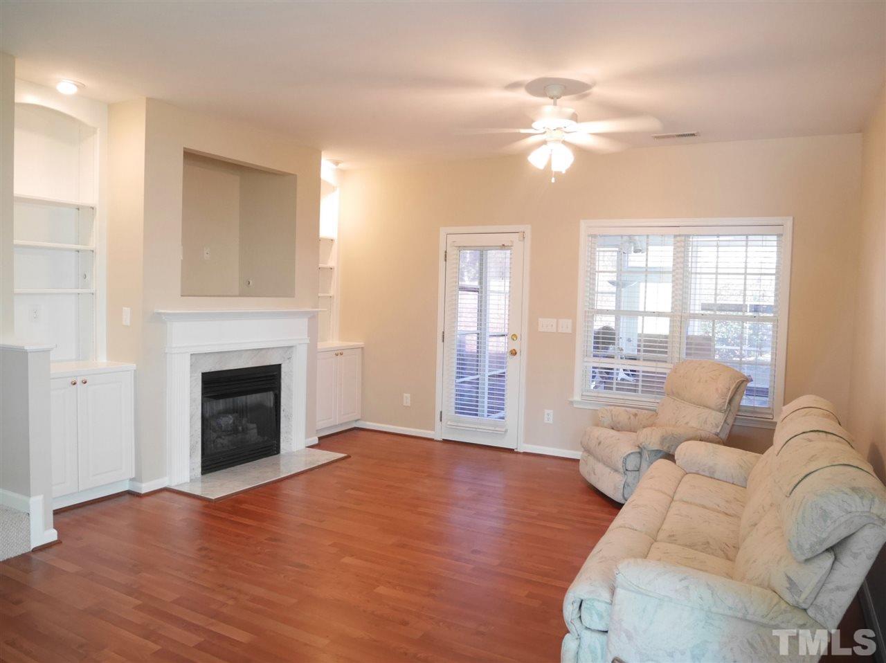2300 Persimmon Ridge Drive Raleigh, NC 27604 - Photo 3 of 20 a living room with furniture and a fireplace