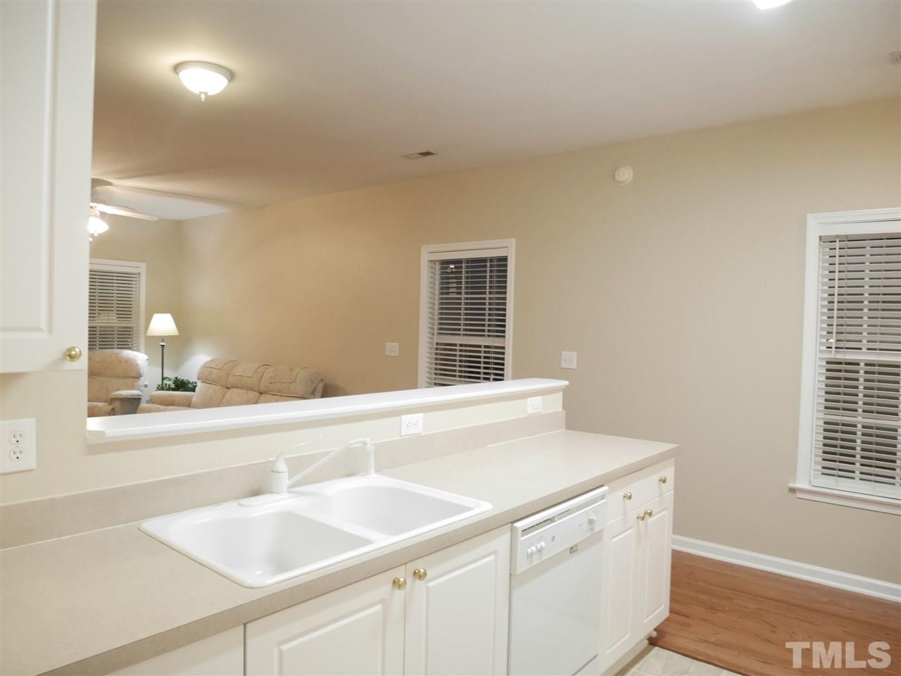2300 Persimmon Ridge Drive Raleigh, NC 27604 - Photo 7 of 20 a kitchen with a sink and a window