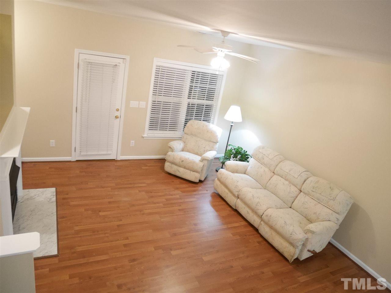 2300 Persimmon Ridge Drive Raleigh, NC 27604 - Photo 8 of 20 a living room with furniture and a potted plant