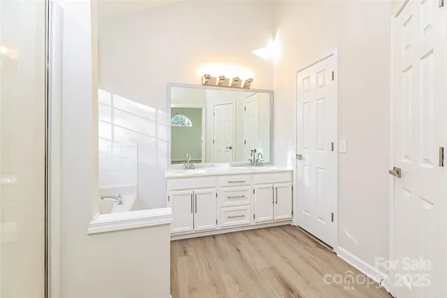 a bathroom with a granite countertop sink mirror and a