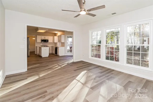 a view of a bedroom with a large bed and large window